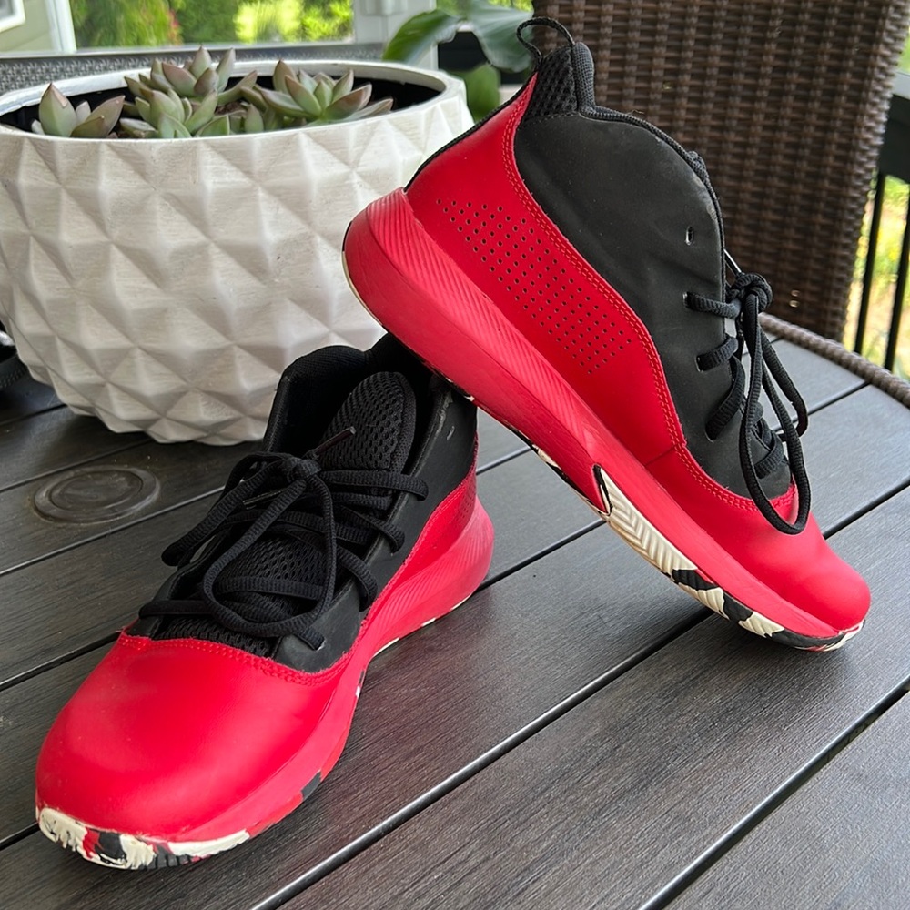 Red high top underarmour shoes